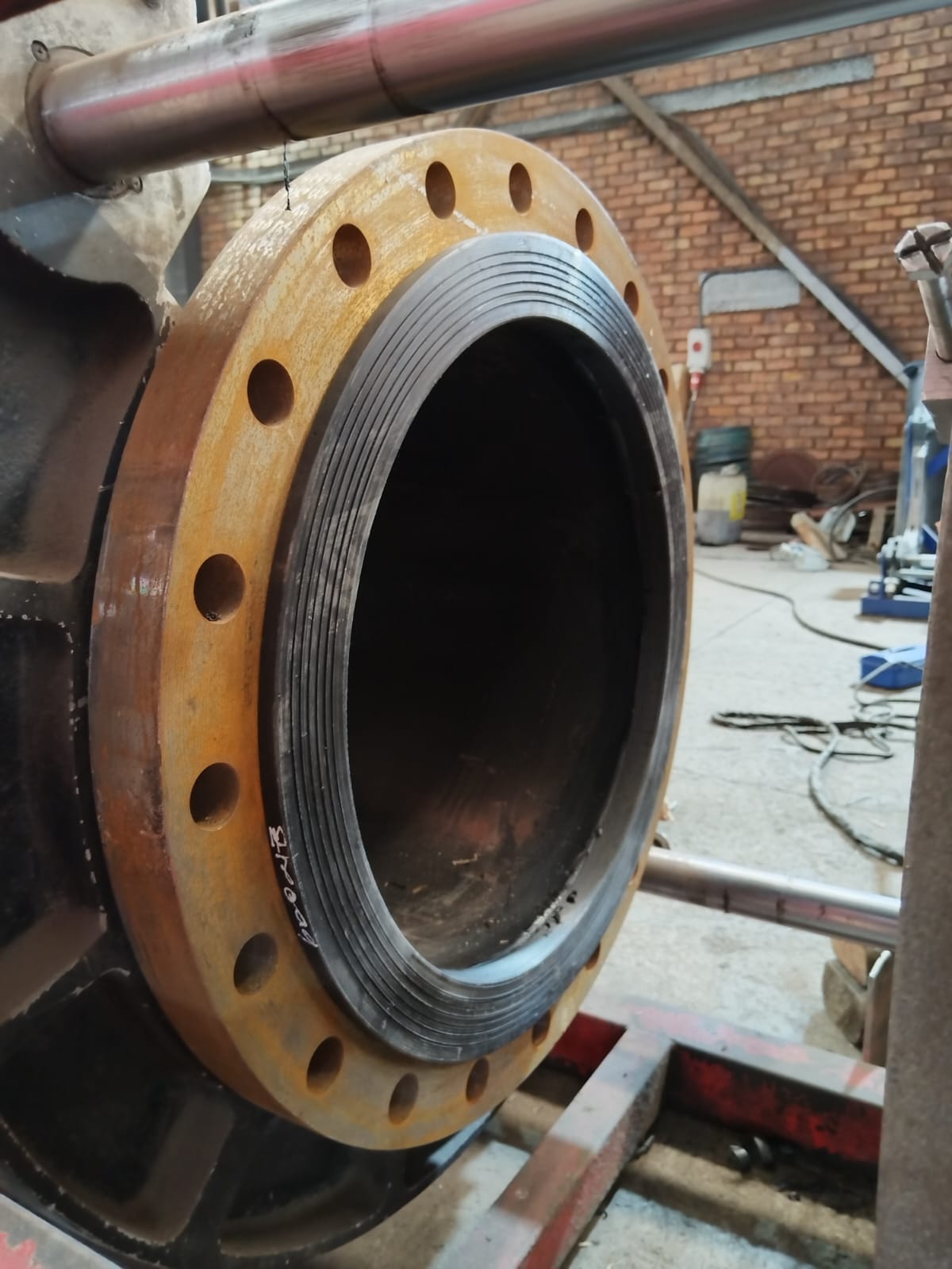 HDPE liner flared into a steel flange face during fabrication at Wetpipe
