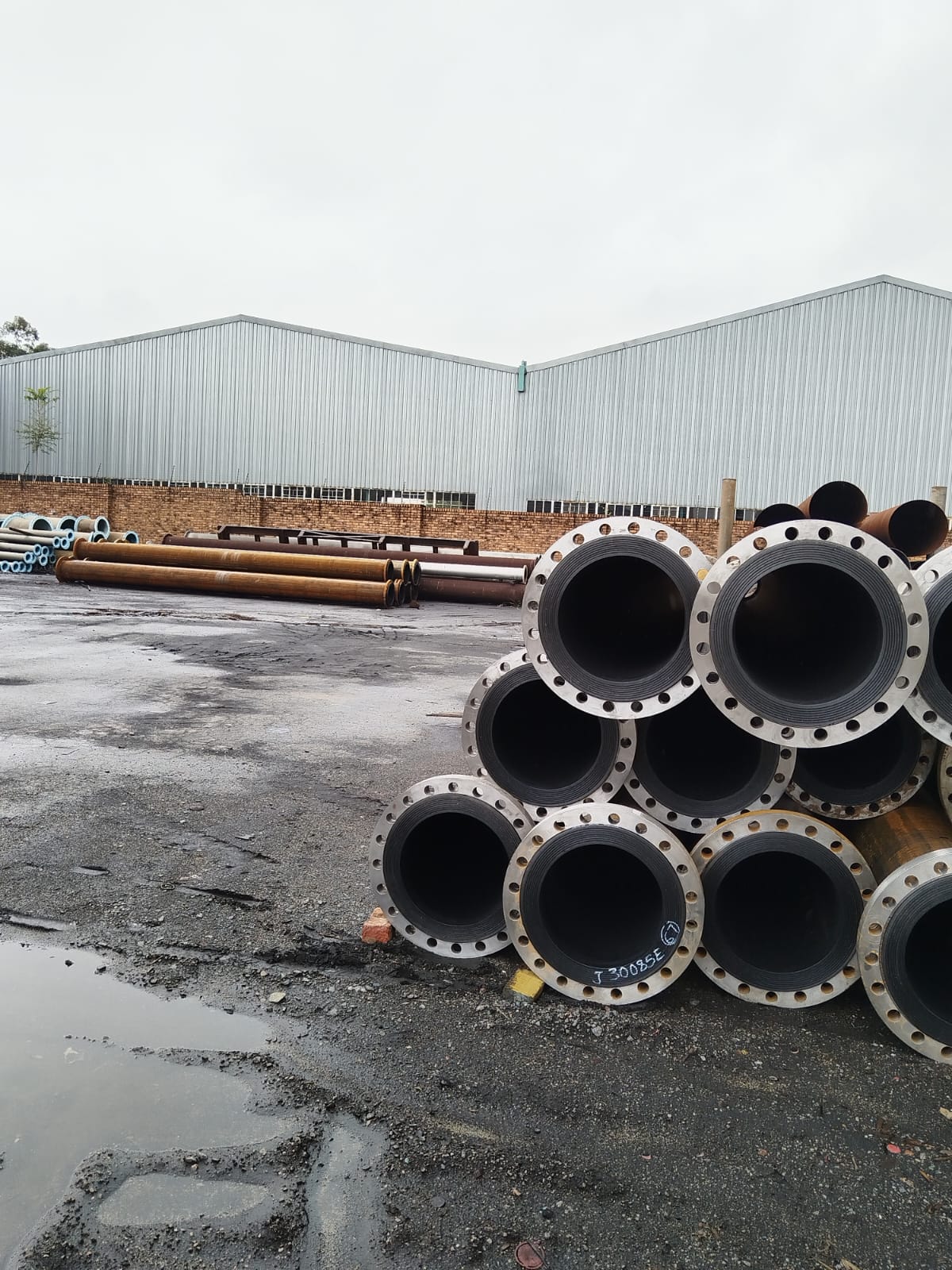 HDPE-lined flanged steel pipes stocked in the Wetpipe yard ready for dispatch