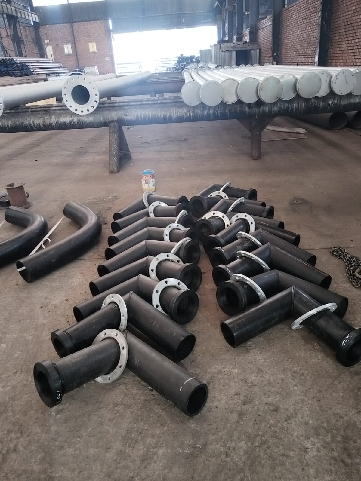 HDPE tees with steel backing flanges staged in the Wetpipe fabrication workshop